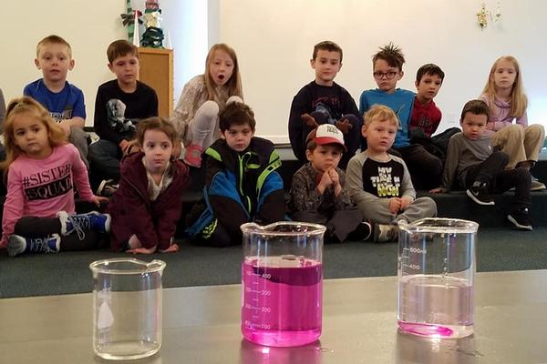 Preschool class watches a science experiment
