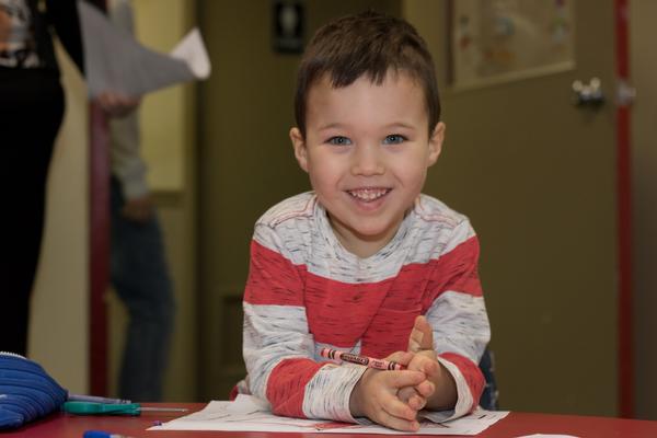 A smiling preschool student