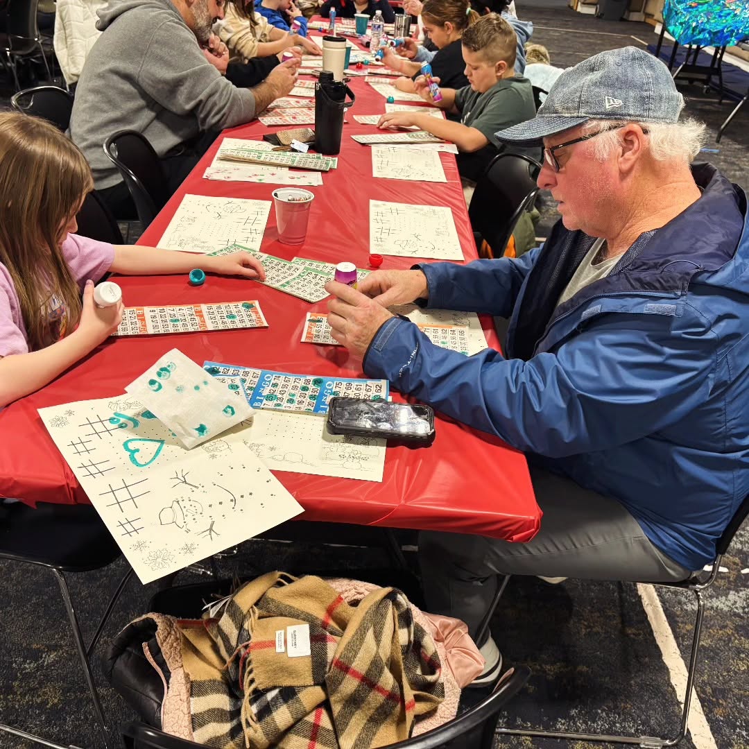 Families and friends playing bingo at an RTCS fundraiser night