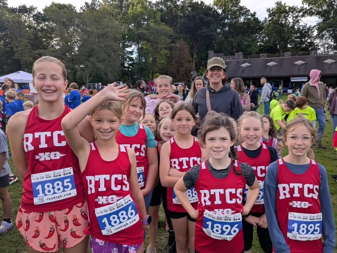 RTCS cross country runners smiling before a 2025 meet